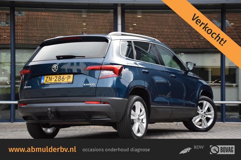 Skoda Karoq 1.0 TSI Style Business | Org. NL | BOVAG Garantie | Trekhaak | Achteruitrijcamera | Full LED | Navigatie | 18'' Velgen | Stoelverwarming | Apple Carplay / Android Auto | afbeelding 1